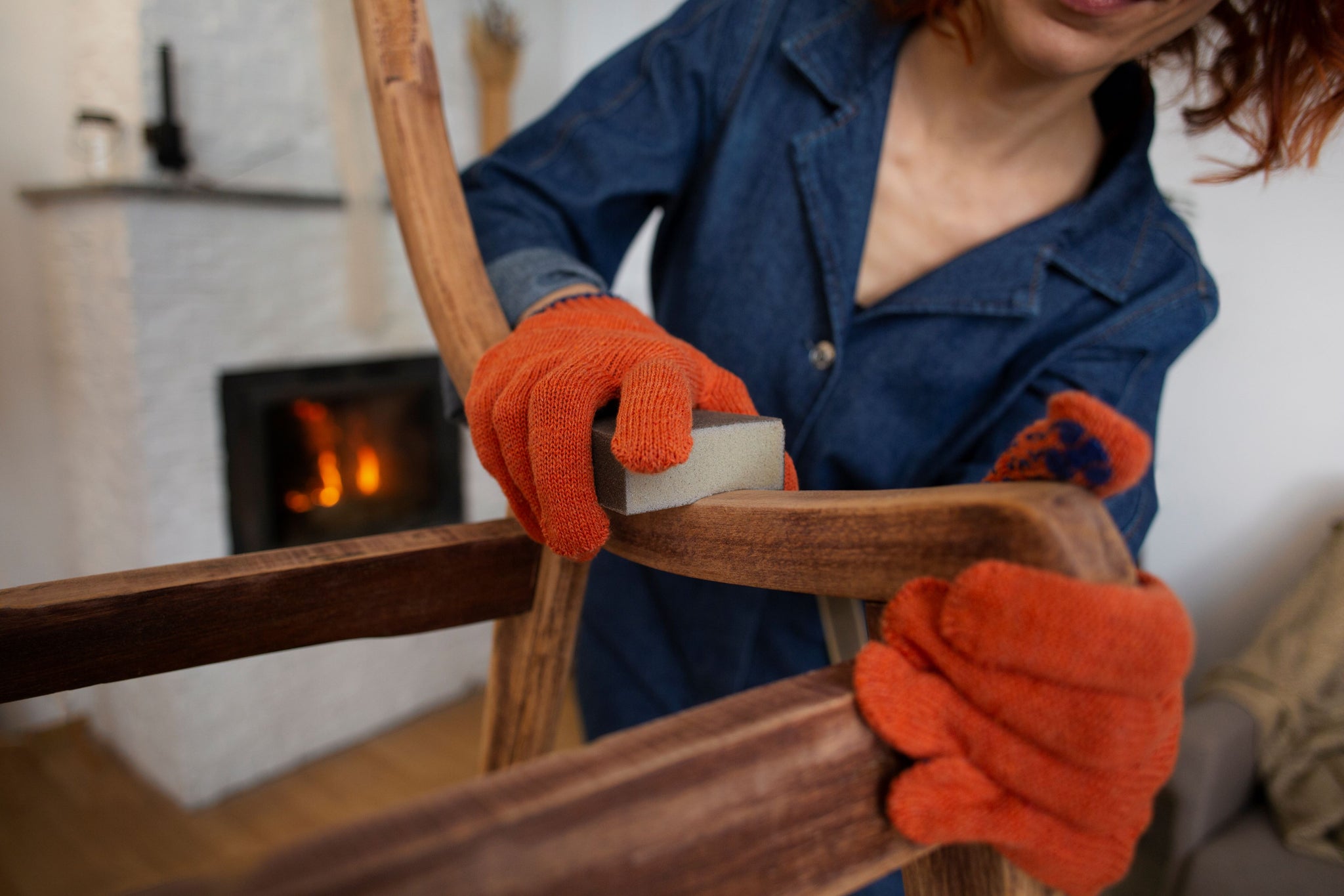 Applying KUNOS 244 Natural Wood Oil to an antique wooden table.
